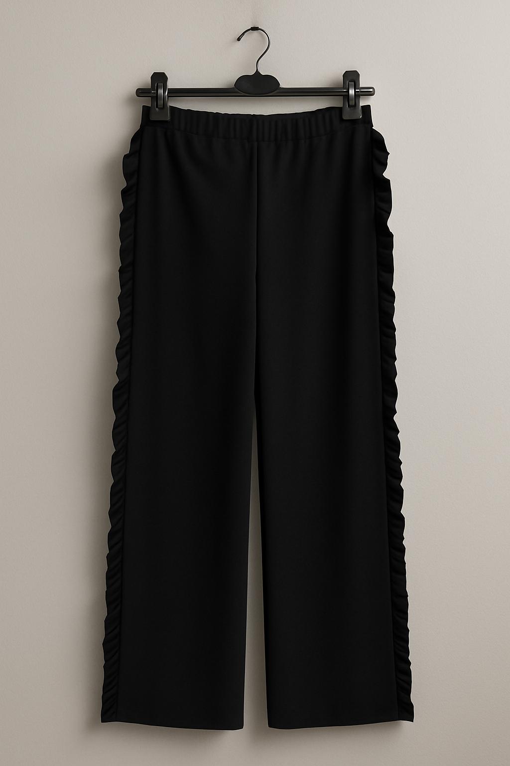 Pantaloni con frange sui lati